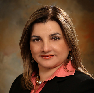 Professional headshot of smiling woman in blazer
